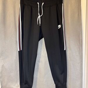 Nike Black Track Pants with White and Red Stripes. Excellent Condition.